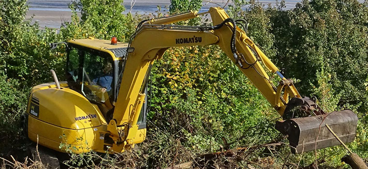 Site clearance using digger in North Wales